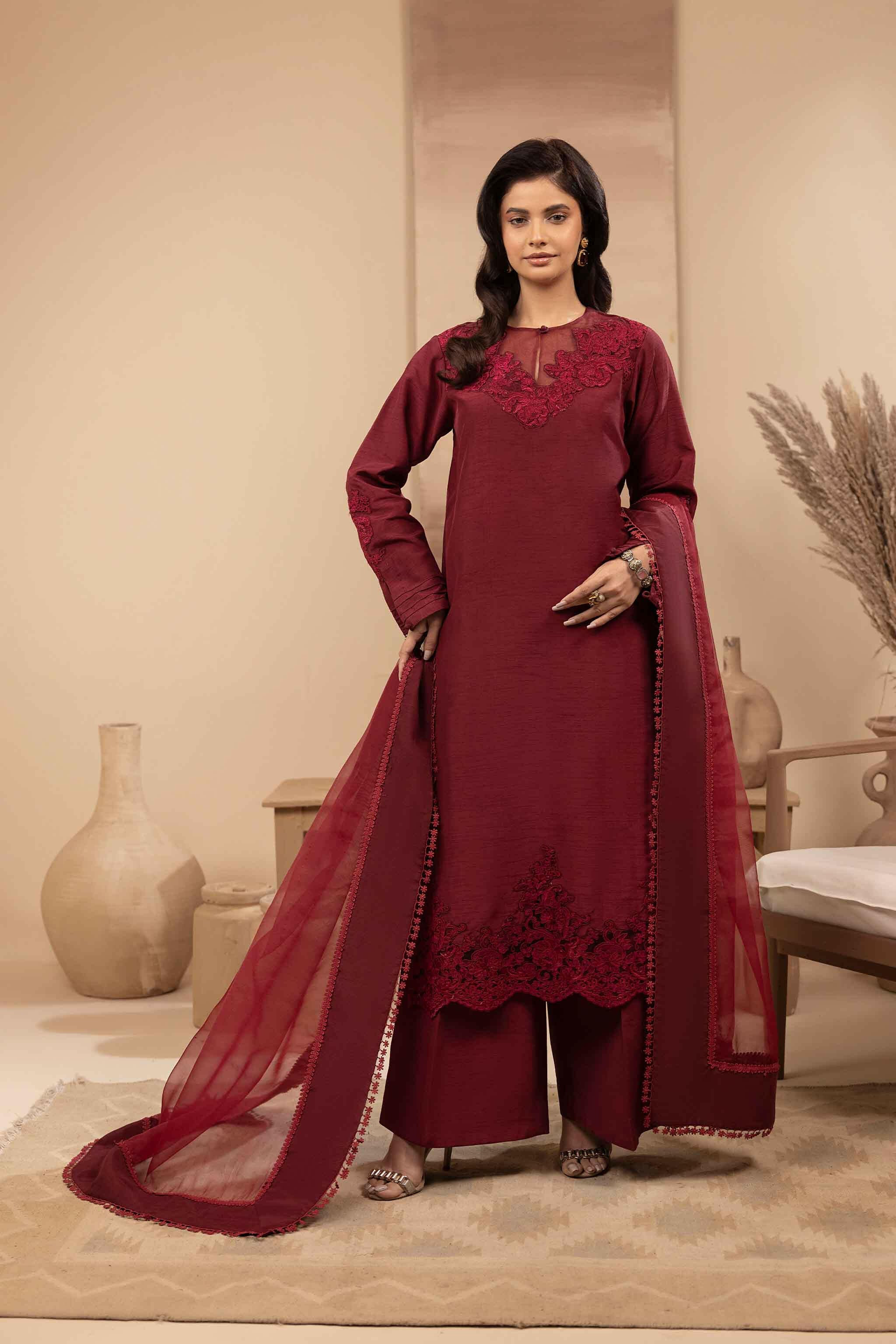 Maroon silk shirt with embroidery and dori work on neckline, sleeves and daman. 