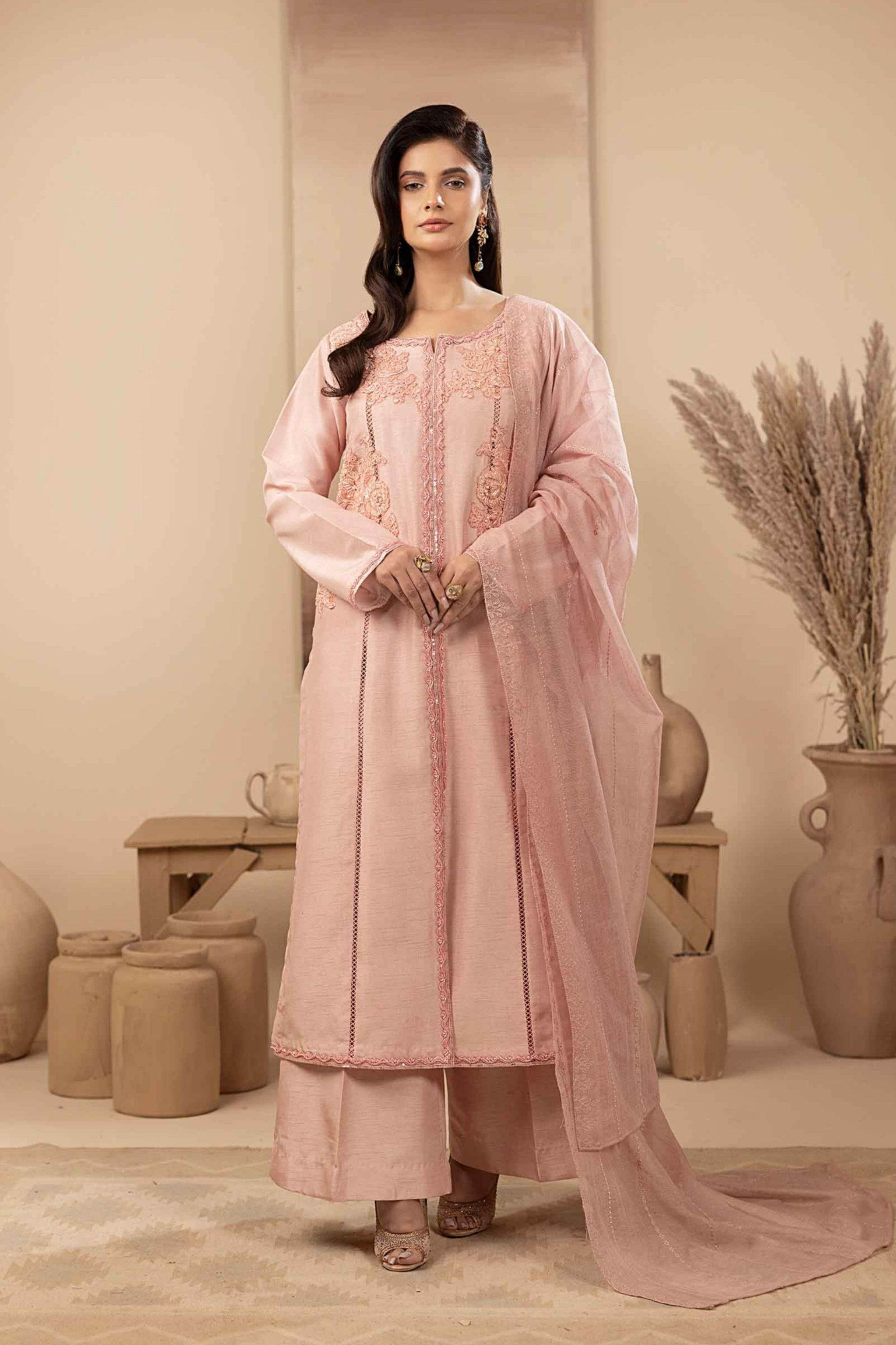 Pink silk shirt with hand embellishments, while the well-tailored sleeves and matching trouser ensure a flawless fit.