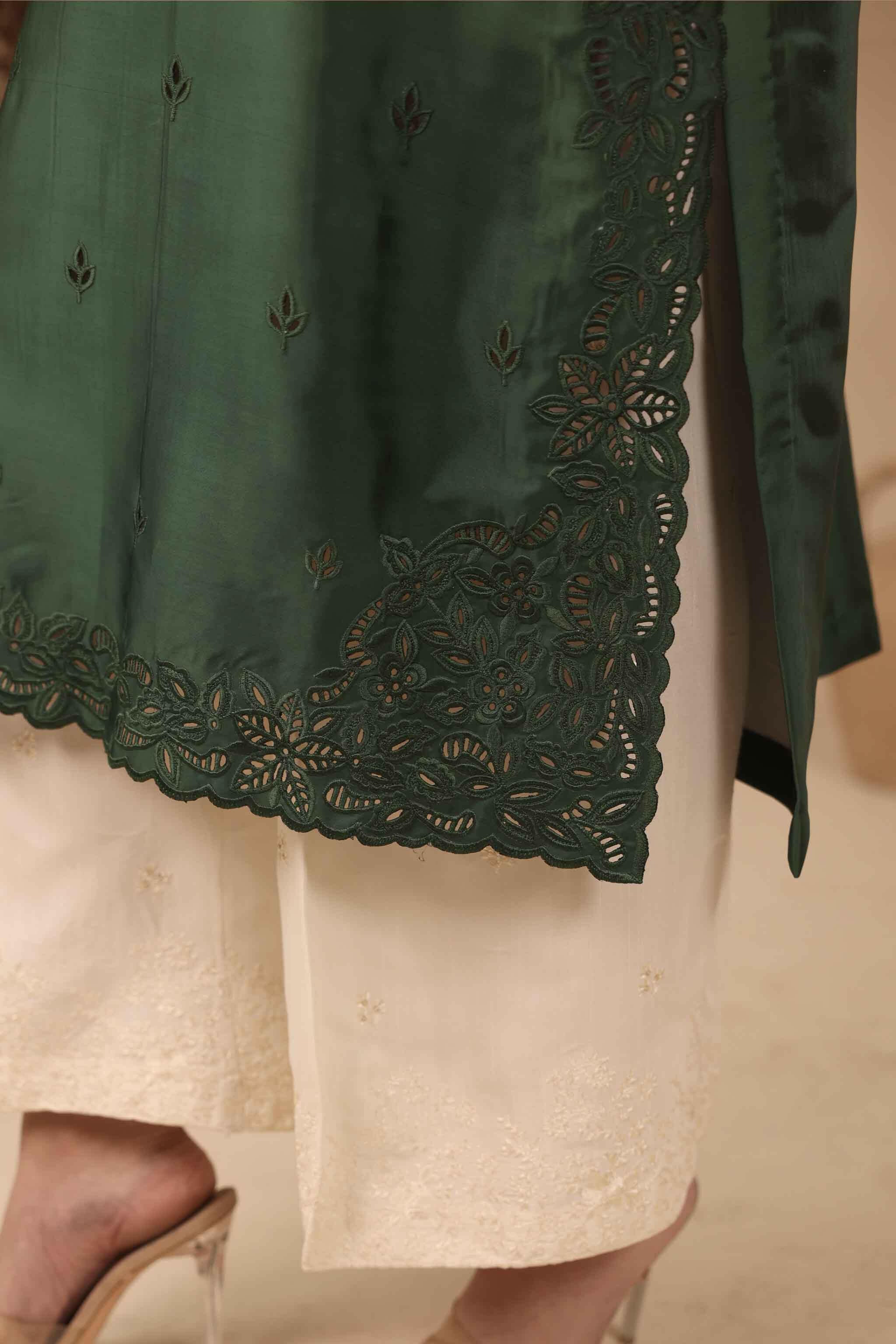 2 piece Green silk long shirt with beautiful ombre and gradient effect from white to green. Cutwork machine embroidery on daman and sleeves, chic tassel at the neckline adds a touch of sophistication.