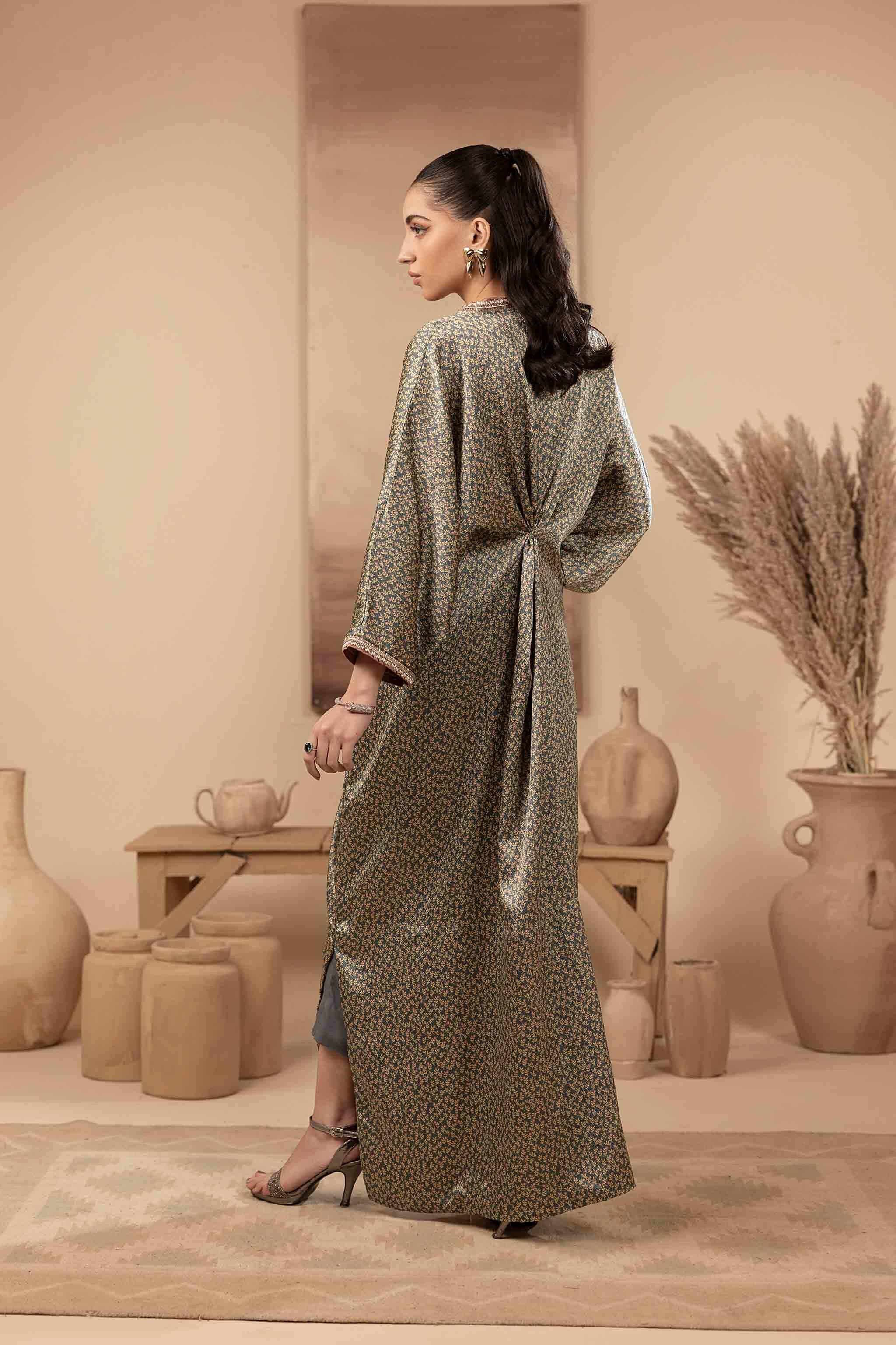 Greenish printed silk kaftan with hand embellished neckline, sleeves and embellished brooch.