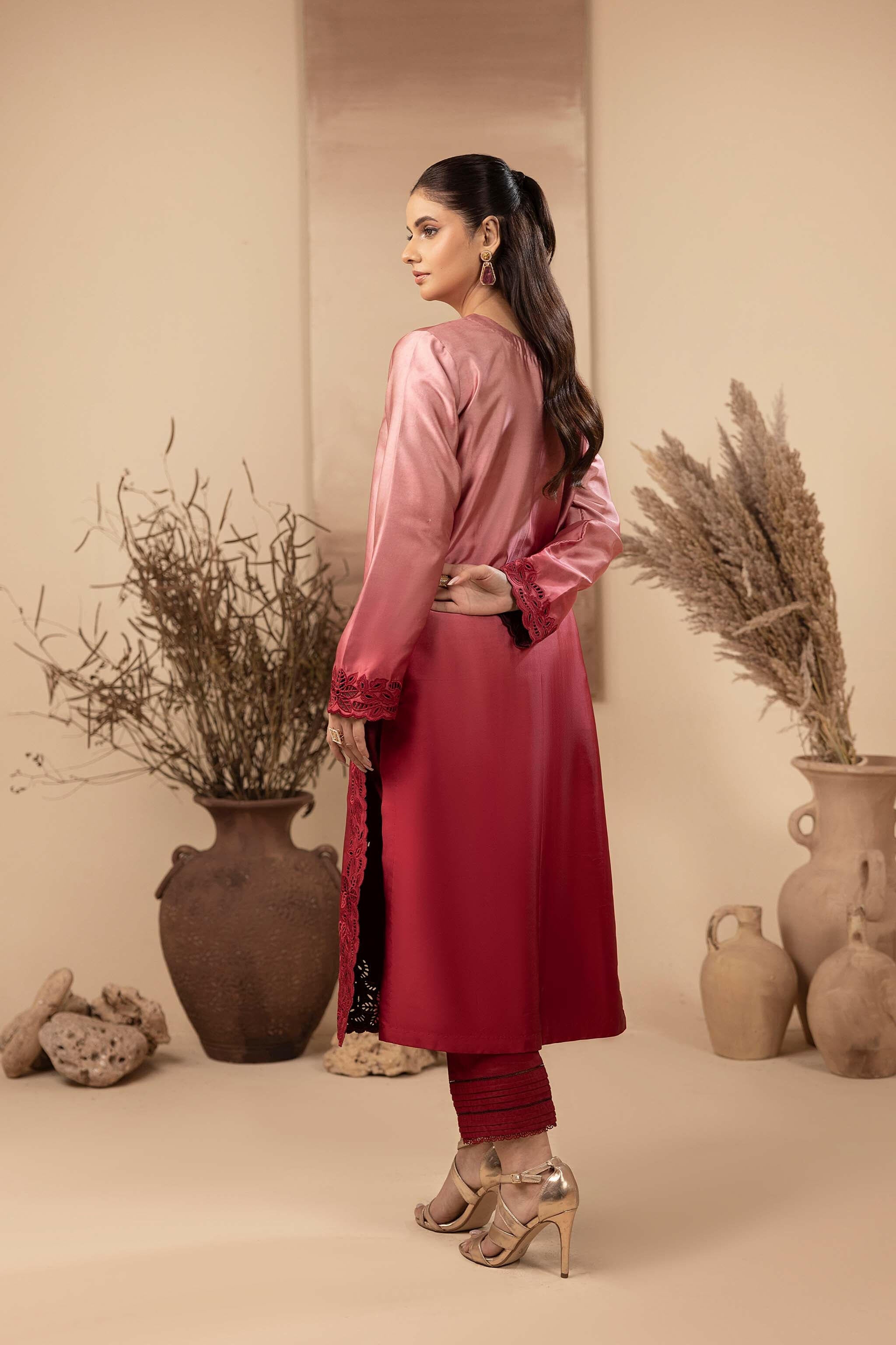 Red silk long shirt, with beautiful ombre effect from baby pink to red. Intricate cutwork machine embroidery adorns the daman and sleeves.